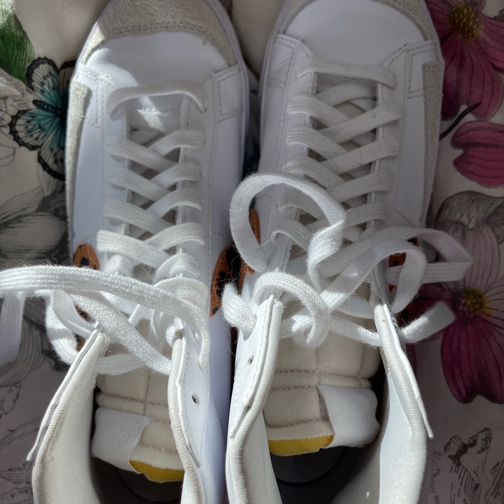 Nike high top white leather with leopard Nike swirl. Size 10